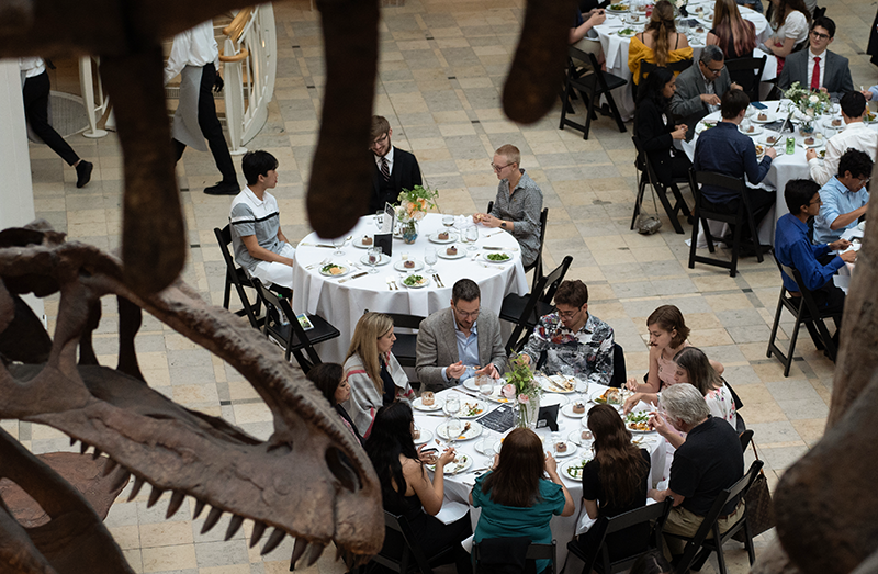 View of the 2022 banquet with a dino head at the corner.