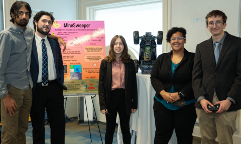 The MineSweeper team during their poster presentation.