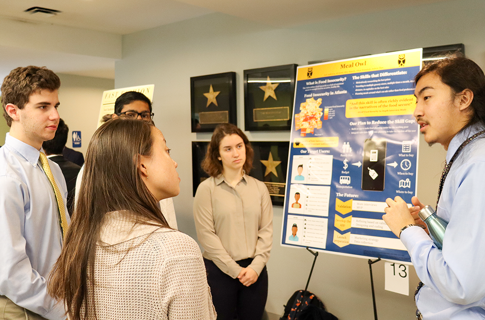 A group of students during a poster session.