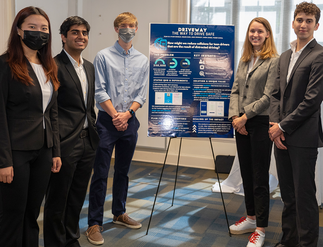 LEAD participants showing their Driveway project at a poster session.